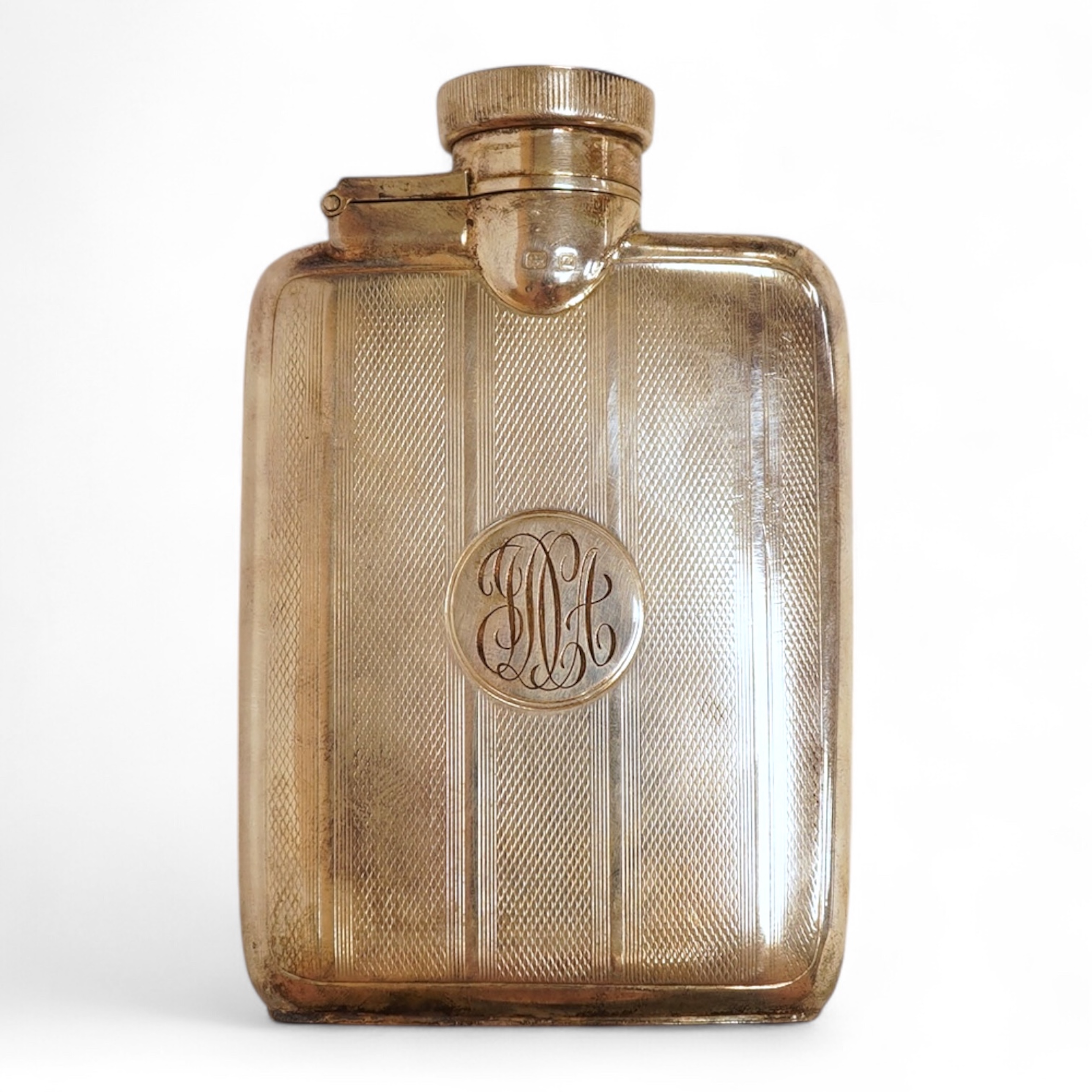 A George V engine turned silver hip flask, William Neale Ltd, Birmingham, 1924, 92mm, 89 grams.